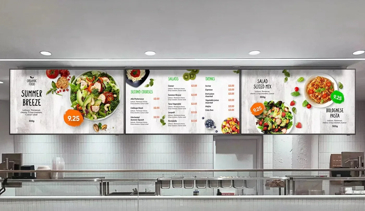 Triple-screen digital menu board above food counter
